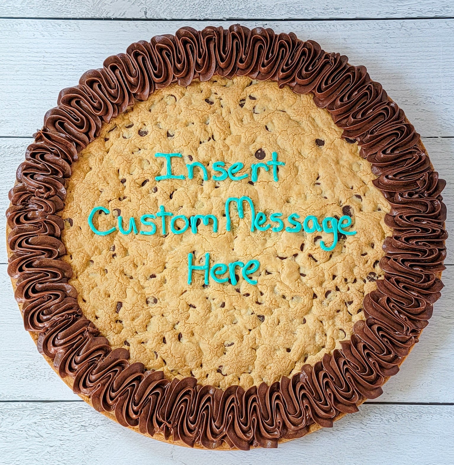 Cookie Cake with frosted border and a frosting message in the middle: "Insert Custom Message Here"